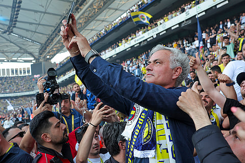 Mourinho takes photographs with supporters
